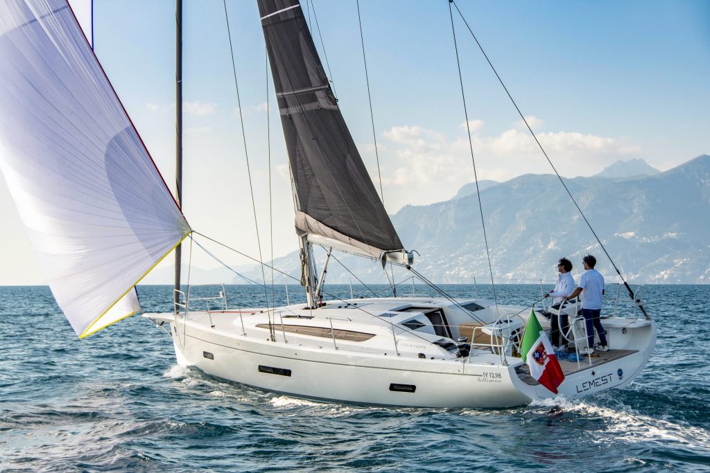 sailing boat. Sails out - photo from behind 